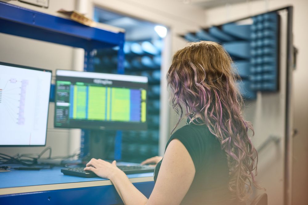 Rowden engineer working by the semi-anechoic chamber at Rowden's offices in Bristol.